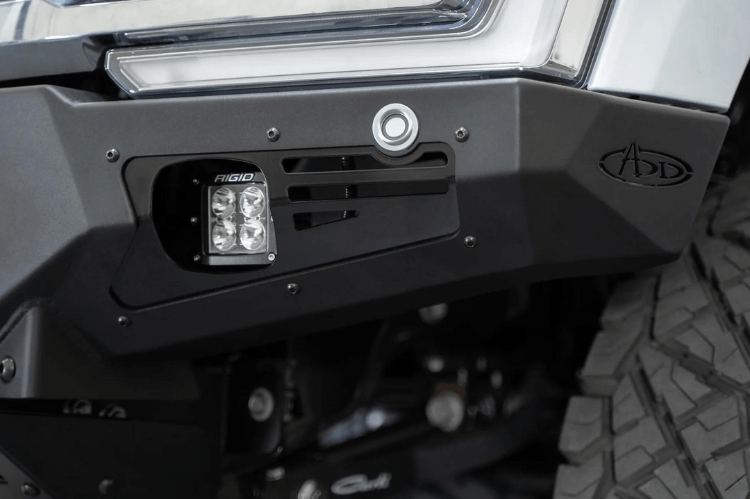 White truck's front end showcasing ADD Bomber Black bumper F810014110103, compatible with Ford Superduty models 2023-2025