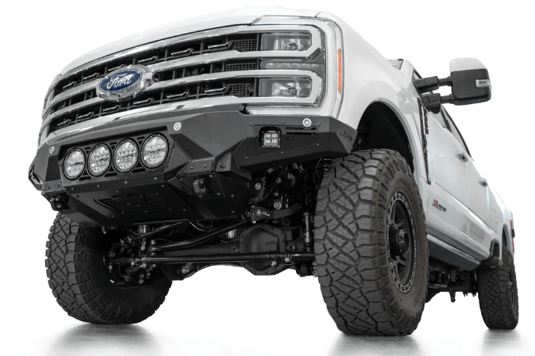 White truck's front end showcasing ADD Bomber Black bumper F810014110103, compatible with Ford Superduty models 2023-2025