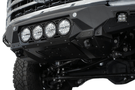 White truck's front end showcasing ADD Bomber Black bumper F810014110103, compatible with Ford Superduty models 2023-2025