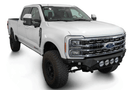 White truck's front end showcasing ADD Bomber Black bumper F810014110103, compatible with Ford Superduty models 2023-2025