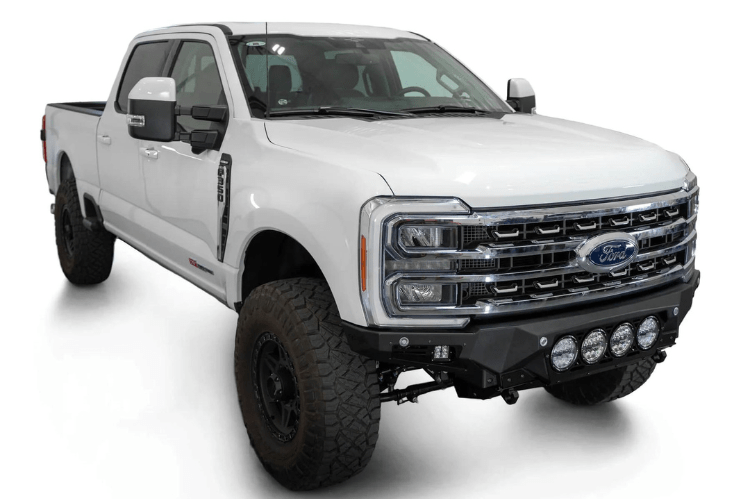 White truck's front end showcasing ADD Bomber Black bumper F810014110103, compatible with Ford Superduty models 2023-2025