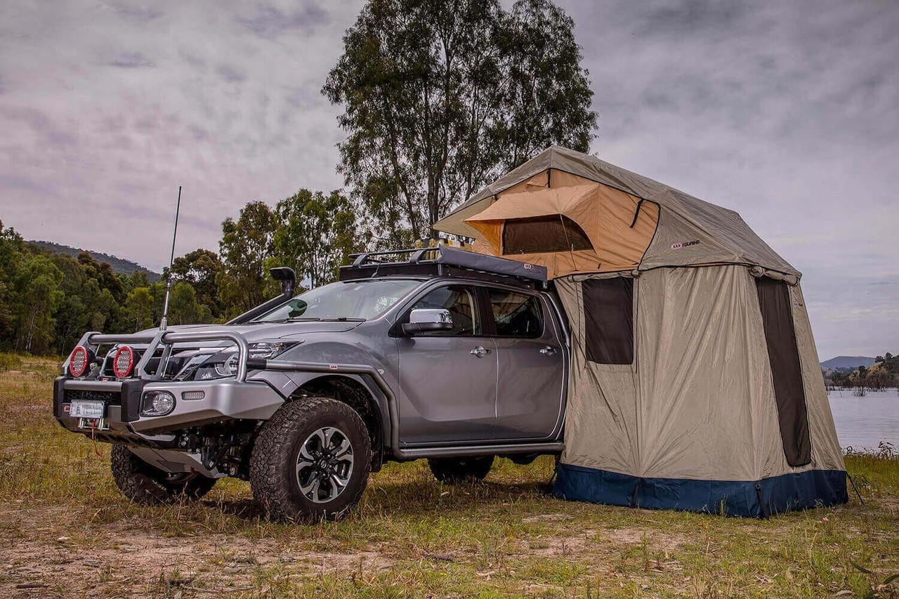 ARB Simpson III rooftop tent with annex 803804 mounted on a truck, featuring a spacious overland shelter