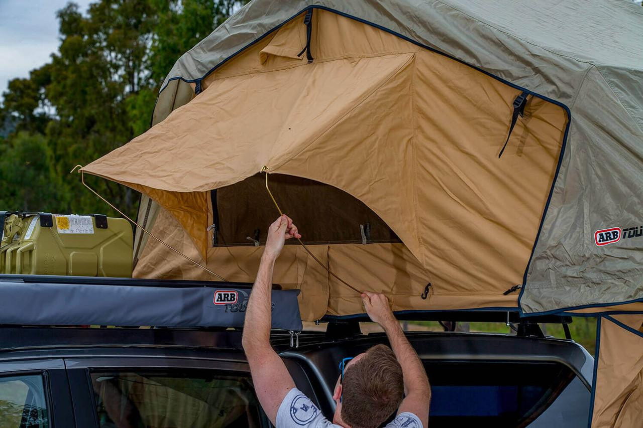 ARB Simpson III rooftop tent with annex 803804 mounted on a truck, featuring a spacious overland shelter