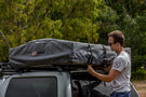 ARB Simpson III rooftop tent with annex 803804 mounted on a truck, featuring a spacious overland shelter