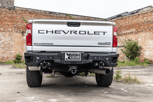 Aftermarket back bumper MFC20BYB for GMC Sierra 2500/3500 with parking sensor cutouts and bare metal finish
