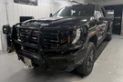 Aftermarket Bodyguard bumper for GMC Sierra truck front-end replacement.