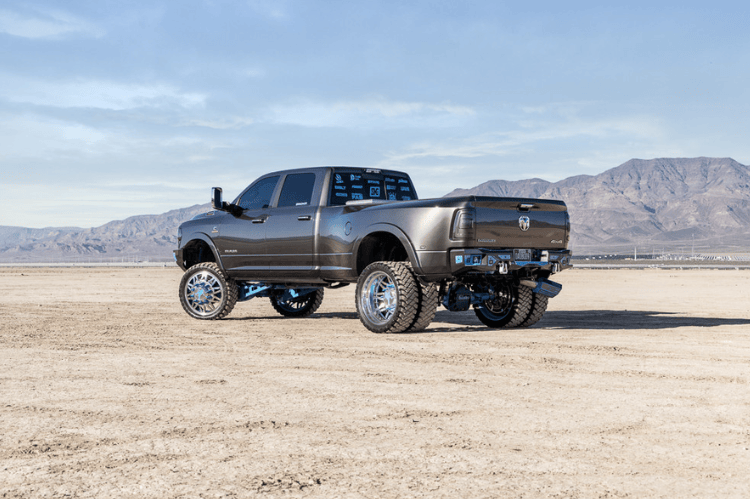 Heavy duty rear bumper with parking sensor cutouts mounted on a 2019–2026 Ram 2500/3500