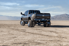 Heavy duty rear bumper with parking sensor cutouts mounted on a 2019–2026 Ram 2500/3500