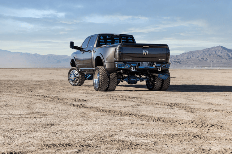 Heavy duty rear bumper with parking sensor cutouts mounted on a 2019–2026 Ram 2500/3500