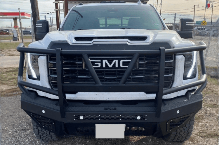 Steel front bumper for GMC Sierra featuring aftermarket design and rugged replacement bumper style.
