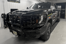Steel front bumper for GMC Sierra featuring aftermarket design and rugged replacement bumper style.
