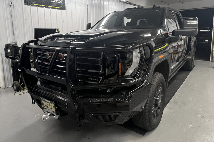 Steel front bumper for GMC Sierra featuring aftermarket design and rugged replacement bumper style.

