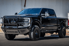 Truck front bumper with Bodyguard grille guard design for Ford Super Duty.