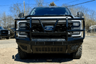 Truck front bumper with Bodyguard grille guard design for Ford Super Duty.