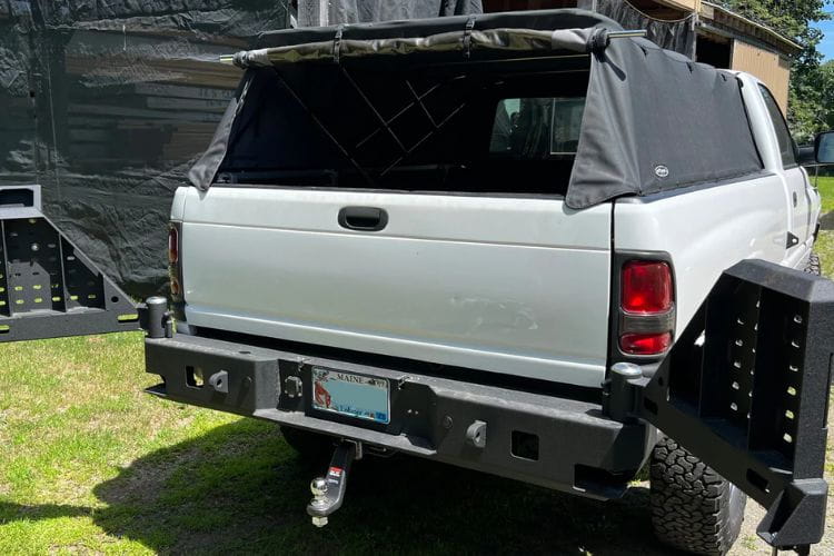 Aftermarket rear bumper Chassis Unlimited CUB960051 dual swing out assemblies upgrade a 1994-2002 Dodge Ram 2500/3500