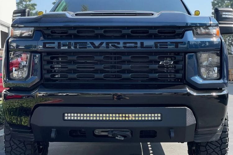 This raw steel custom front bumper CUB990555RAW by Chassis Unlimited brings a bold face to a 2020-2023 Chevy Silverado 2500/3500