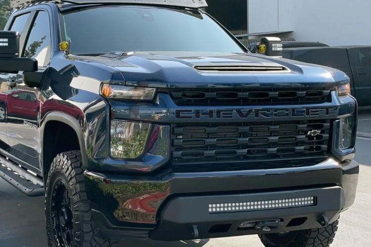 This raw steel custom front bumper CUB990555RAW by Chassis Unlimited brings a bold face to a 2020-2023 Chevy Silverado 2500/3500