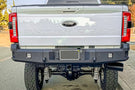 Chassis Unlimited CUB990751RAW heavy duty rear truck bumper for 2023+ Ford Super Duty F250/F350 with raw steel finish, cube lights and steps.