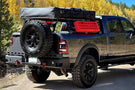 Chassis Unlimited Octane CUB960012 aftermarket rear bumper with dual swing-out tire carrier for 2010–2025 Ram 2500/3500, textured black