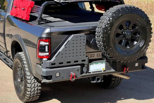 Chassis Unlimited Octane CUB960012 aftermarket rear bumper with dual swing-out tire carrier for 2010–2025 Ram 2500/3500, textured black