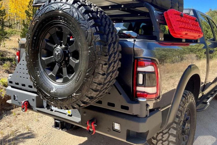Chassis Unlimited Octane CUB960012 aftermarket rear bumper with dual swing-out tire carrier for 2010–2025 Ram 2500/3500, textured black