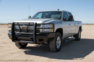 Fully equipped 2014 Chevy Silverado 2500HD Complete Protection Kit showcasing Steelcraft protection and AMP Research power steps