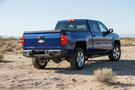 2019 Chevy Silverado 2500HD Complete Protection Kit with tough Ranch Hand bumpers and sleek AMP Research power steps