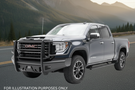 Upgraded 2023 GMC Sierra 2500HD featuring tough Fab Fours bumpers and sleek AMP Research steps