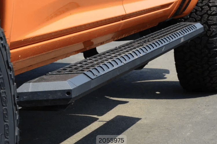 2016 F250 Super Duty outfitted with Fab Fours bumpers and Aries steps, giving the truck a tough, battle-ready look