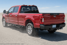 Bold 2022 Ford F250 equipped with Ranch Hand bumpers and Raptor Series steps for off-road and work-ready performance