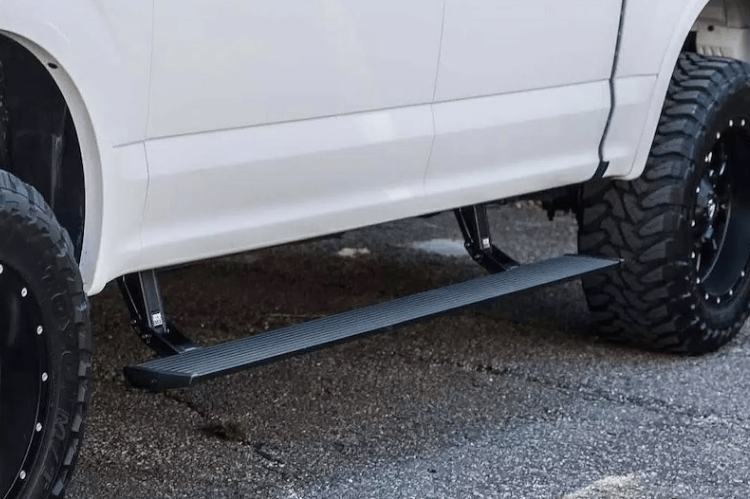 2009 Dodge Ram 2500 truck equipped with Fab Fours bumpers and AMP Research steps — designed for performance and durability