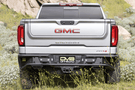 DV8 Offroad truck rear bumper RBCS1-04 for 2019–2025 GMC Sierra 1500, heavy-duty steel bumper for rugged rear-end protection.