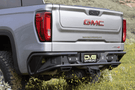 DV8 Offroad truck rear bumper RBCS1-04 for 2019–2025 GMC Sierra 1500, heavy-duty steel bumper for rugged rear-end protection.