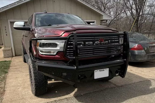 Fab Fours DR19-S4460-1 Black Steel full guard front bumper for 2019–2024 Dodge Ram 2500 and 3500 HD, heavy-duty off-road bumper with full grille and headlight protection parked on a driveway.