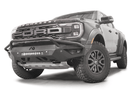 Fab Fours FR24-D6452-1 Vengeance Front Bumper with Pre-runner Guard installed on a 2024 Ford Ranger Raptor, featuring a high and tight fit, 11-gauge U.S. steel construction, matte black powder coat finish, and integrated mounts for a 20-inch LED light bar and dual cube lights.