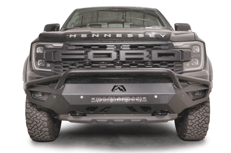 Fab Fours FR24-D6452-1 Vengeance Front Bumper with Pre-runner Guard installed on a 2024 Ford Ranger Raptor, featuring a high and tight fit, 11-gauge U.S. steel construction, matte black powder coat finish, and integrated mounts for a 20-inch LED light bar and dual cube lights.