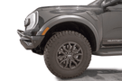 Fab Fours FR24-D6452-1 Vengeance Front Bumper with Pre-runner Guard installed on a 2024 Ford Ranger Raptor, featuring a high and tight fit, 11-gauge U.S. steel construction, matte black powder coat finish, and integrated mounts for a 20-inch LED light bar and dual cube lights.