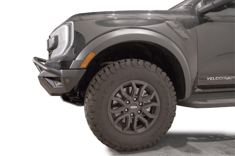 Fab Fours FR24-D6452-1 Vengeance Front Bumper with Pre-runner Guard installed on a 2024 Ford Ranger Raptor, featuring a high and tight fit, 11-gauge U.S. steel construction, matte black powder coat finish, and integrated mounts for a 20-inch LED light bar and dual cube lights.