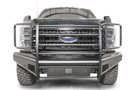Fab Fours FS23-Q5960-1 Black Steel Elite Full Guard Front Bumper installed on a 2023 Ford F-250 Super Duty, featuring a matte black powder-coated finish, full grille guard, sensor compatibility, and mounts for 3x3 LED cube lights.