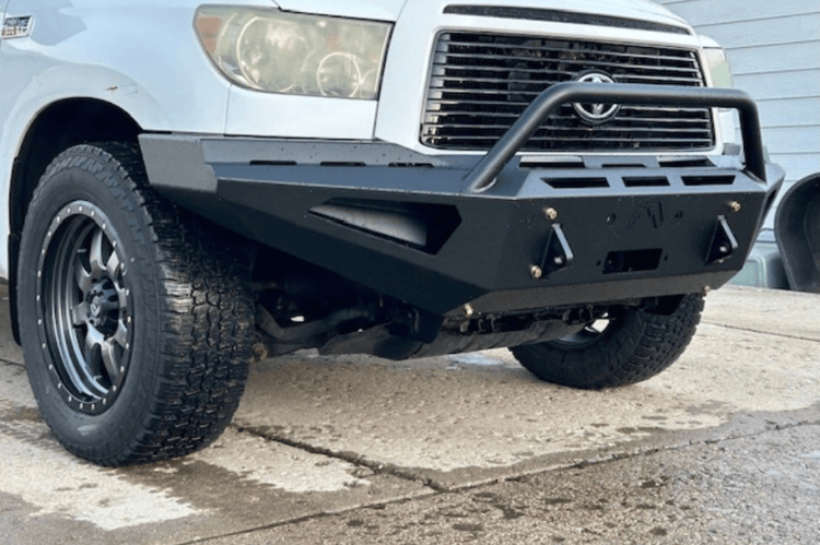 Close-up of a Fab Fours Red Steel TT07-RS1862-1 Front Bumper with Winch Ready Pre-Runner Guard for 2007-2013 Toyota Tundra.