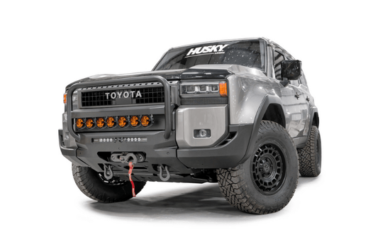 Fab Fours TL24-N6752-1 heavy duty front winch bumper with grille guard for 2024-2026 Toyota Land Cruiser; features hidden winch mount and pre-runner guard