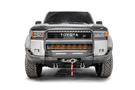 Fab Fours TL24-N6752-1 heavy duty front winch bumper with grille guard for 2024-2026 Toyota Land Cruiser; features hidden winch mount and pre-runner guard