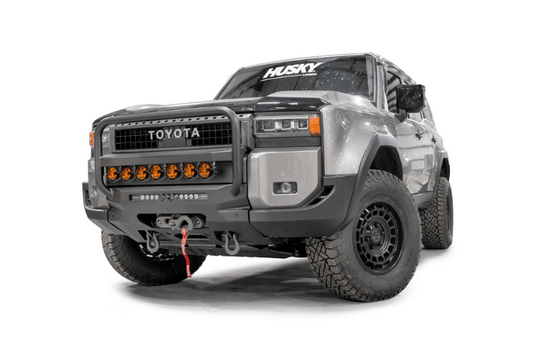 Fab Fours TL24-N6752-1 heavy duty front winch bumper with grille guard for 2024 Toyota Land Cruiser; features hidden winch mount and pre-runner guard