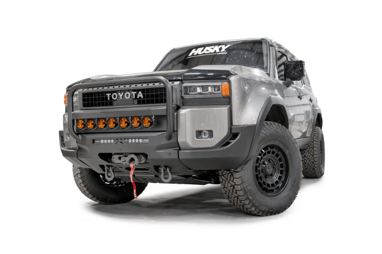 Fab Fours TL24-N6752-1 heavy duty front winch bumper with grille guard for 2024 Toyota Land Cruiser; features hidden winch mount and pre-runner guard