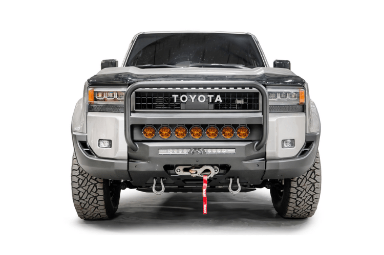 Fab Fours TL24-N6752-1 heavy duty front winch bumper with grille guard for 2024 Toyota Land Cruiser; features hidden winch mount and pre-runner guard
