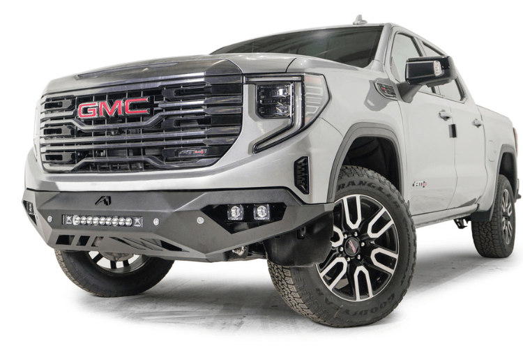 Silver GMC Sierra truck's front end showcasing the Fab Fours Vengeance bumper, model GS23-D5851-1, for 2022.5-2024