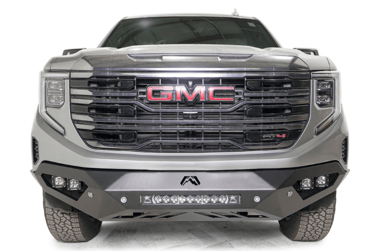 Silver GMC Sierra truck's front end showcasing the Fab Fours Vengeance bumper, model GS23-D5851-1, for 2022.5-2024