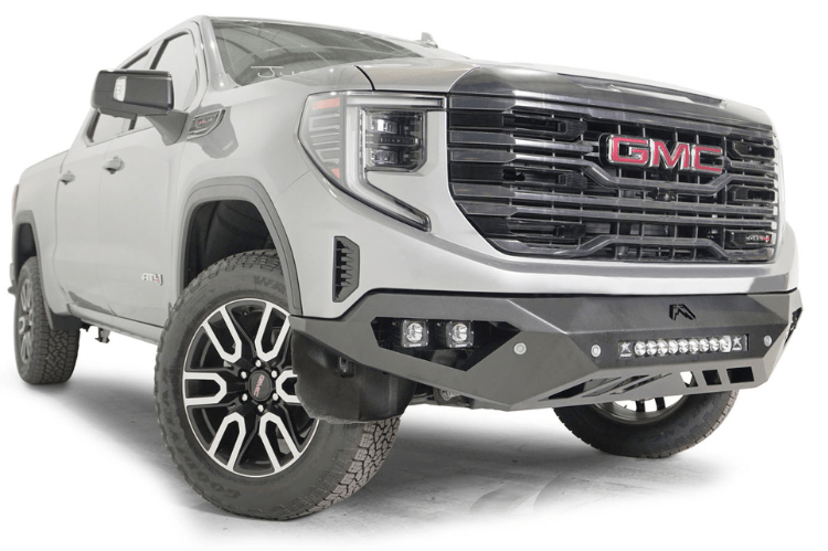 Silver GMC Sierra truck's front end showcasing the Fab Fours Vengeance bumper, model GS23-D5851-1, for 2022.5-2024
