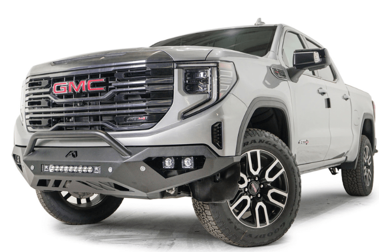 Silver GMC truck featuring Fab Fours Vengeance Front Bumper Pre-Runner Guard for GMC Sierra 1500 2022.5-2024
