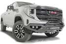 Silver GMC Sierra 1500 truck's front end showcasing a black Fab Fours Vengeance bumper guard